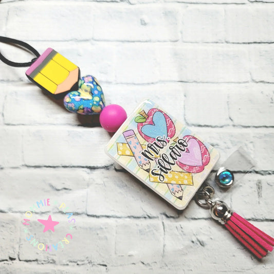 Handmade teacher badge reel with colorful beads, pencil charm, heart, and pink tassel gift