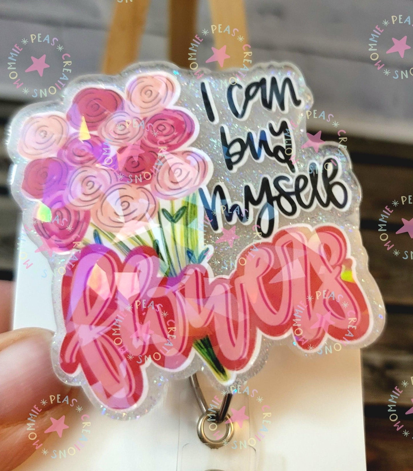 Handmade glitter badge reel with pink and purple bouquet and 'I can buy myself flowers' text