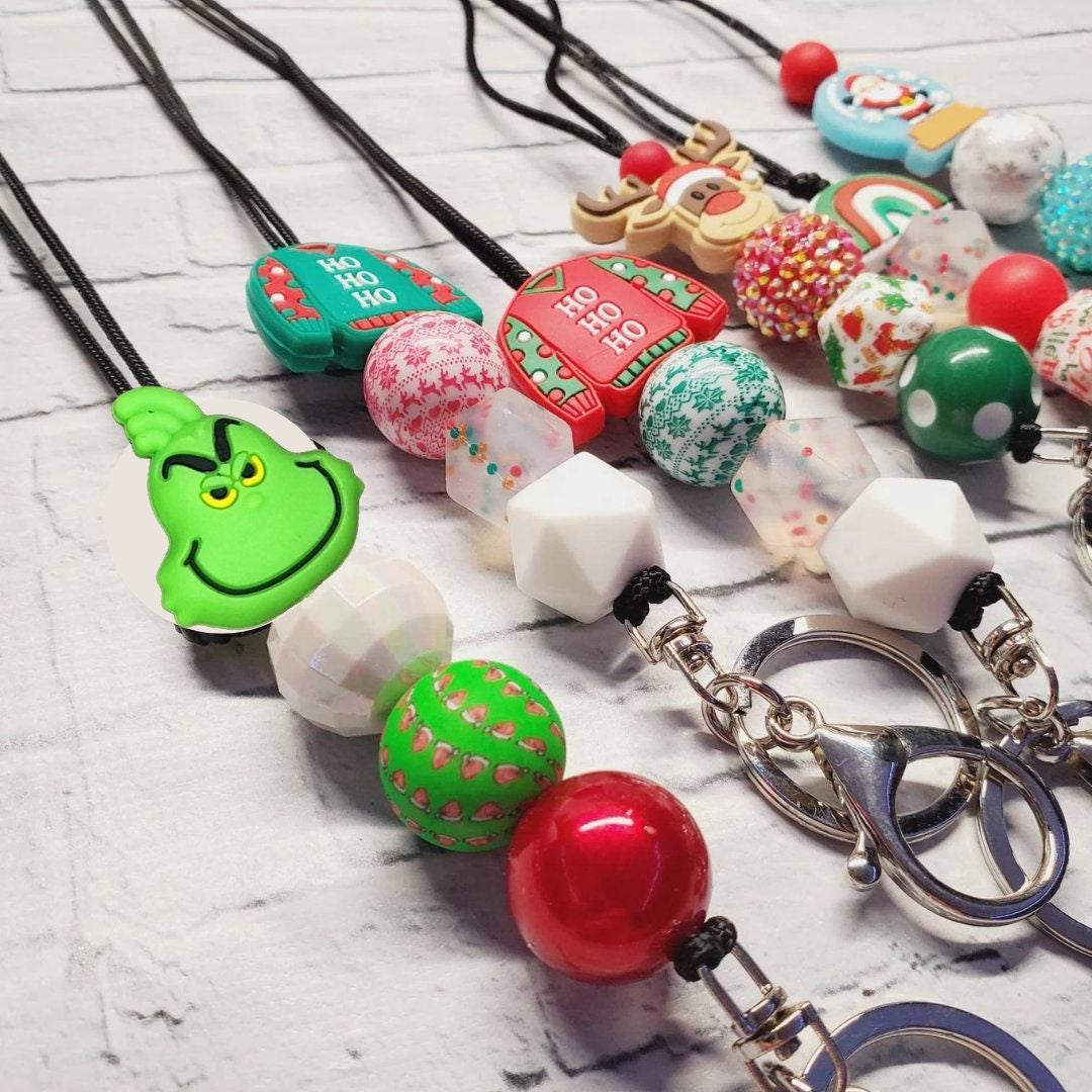 Colorful handmade Christmas lanyards and keychains with festive beads and charms, unique gift.