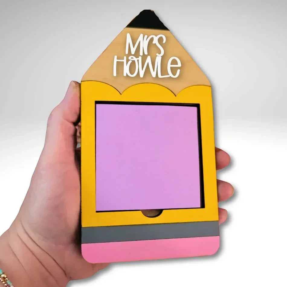 Mommie Peas Creations yellow laser cut wooden pencil Post-it note holder with pink eraser and grey band, personalized with 'Mrs Howle'.