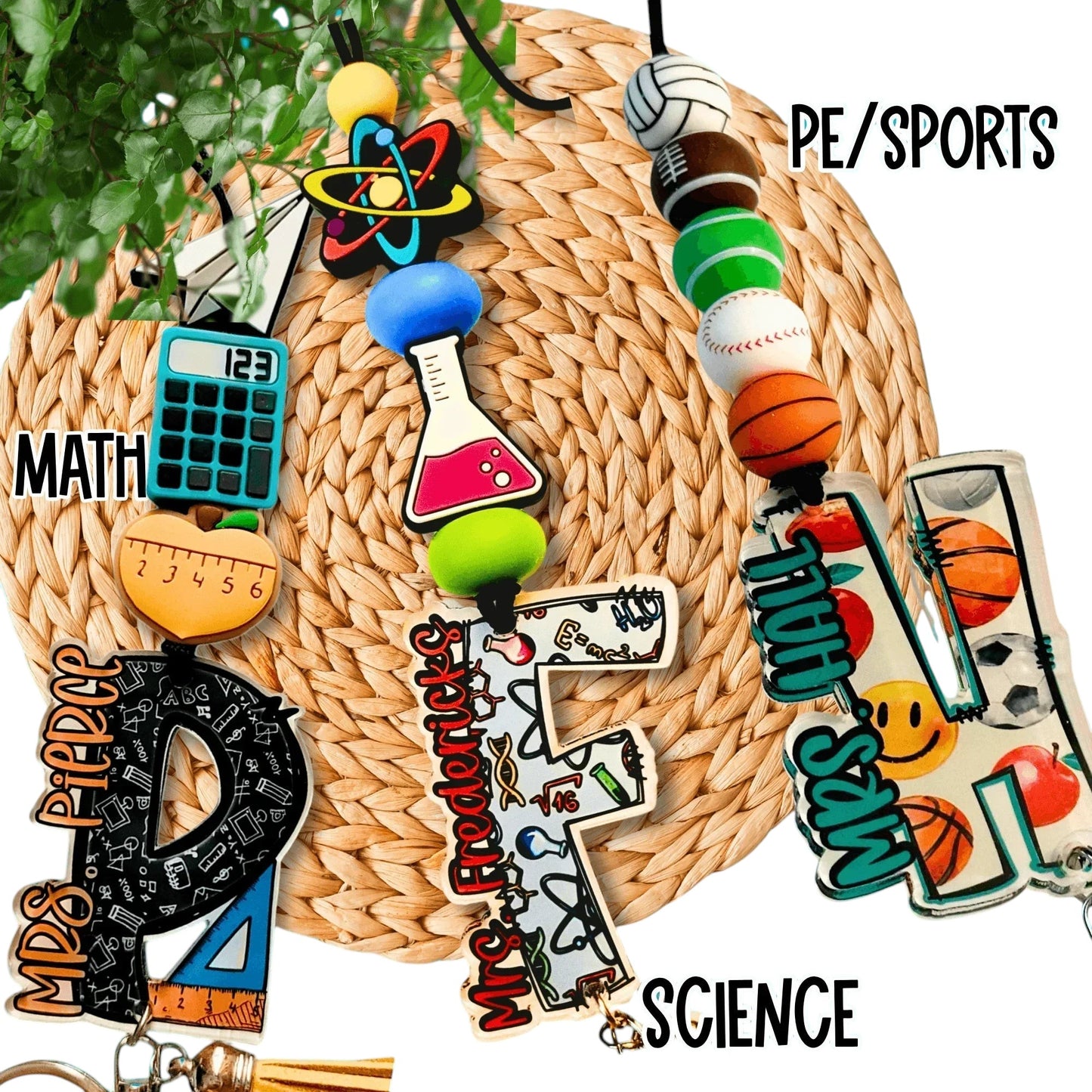 Colorful handmade teacher lanyards for math, science, and PE with unique charms and beads.