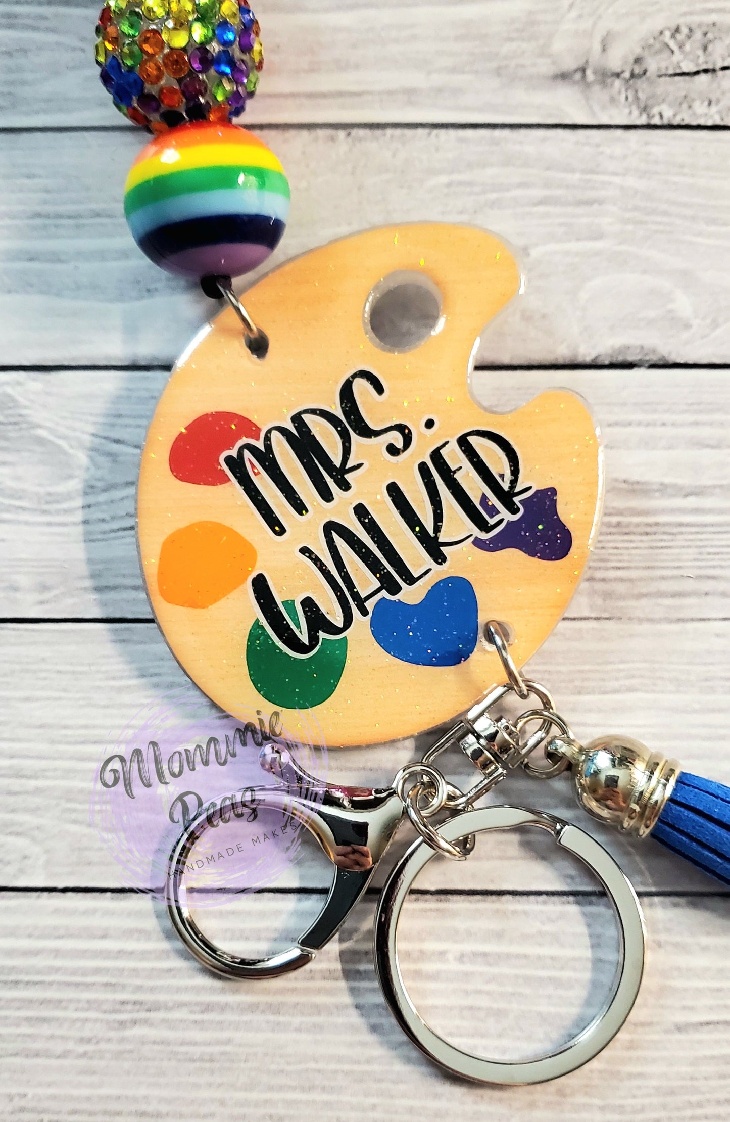 Handmade gift keychain with colorful beads, artist palette, custom name, and tassel