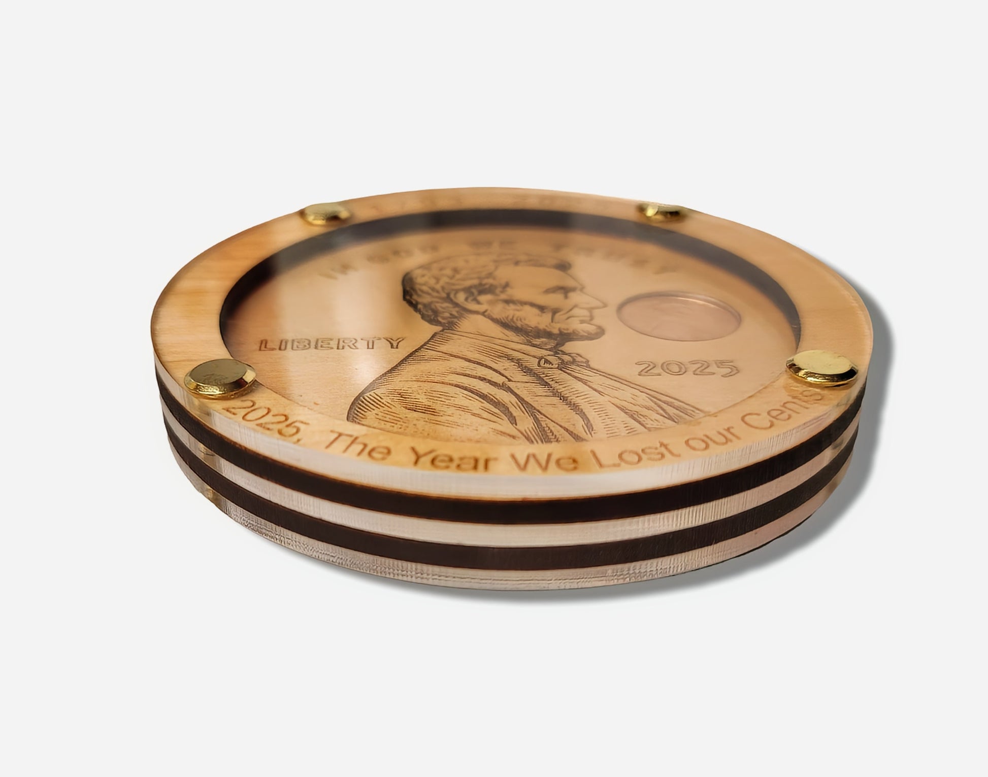 Handmade round wooden penny display with engraved details and gold screws, unique gift item