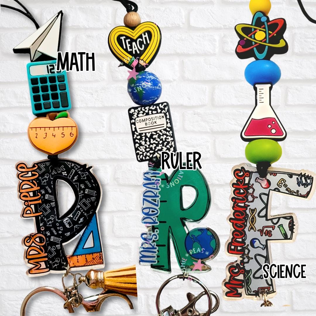 Teacher lanyards with math, ruler, and science-themed bead toppers including calculator, globe, and chemistry flask; each with personalized name initials in acrylic