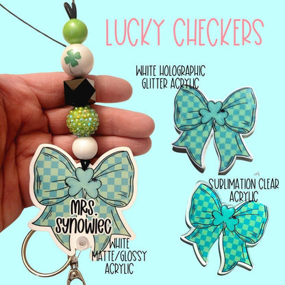 Hand holding keychain with green clover beads and custom Lucky Checkers bow keychains in white matte and clear acrylic