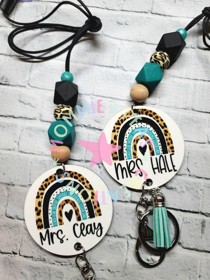 Personalized teacher keychains with leopard print rainbows, wooden and geometric beads, and mint tassels