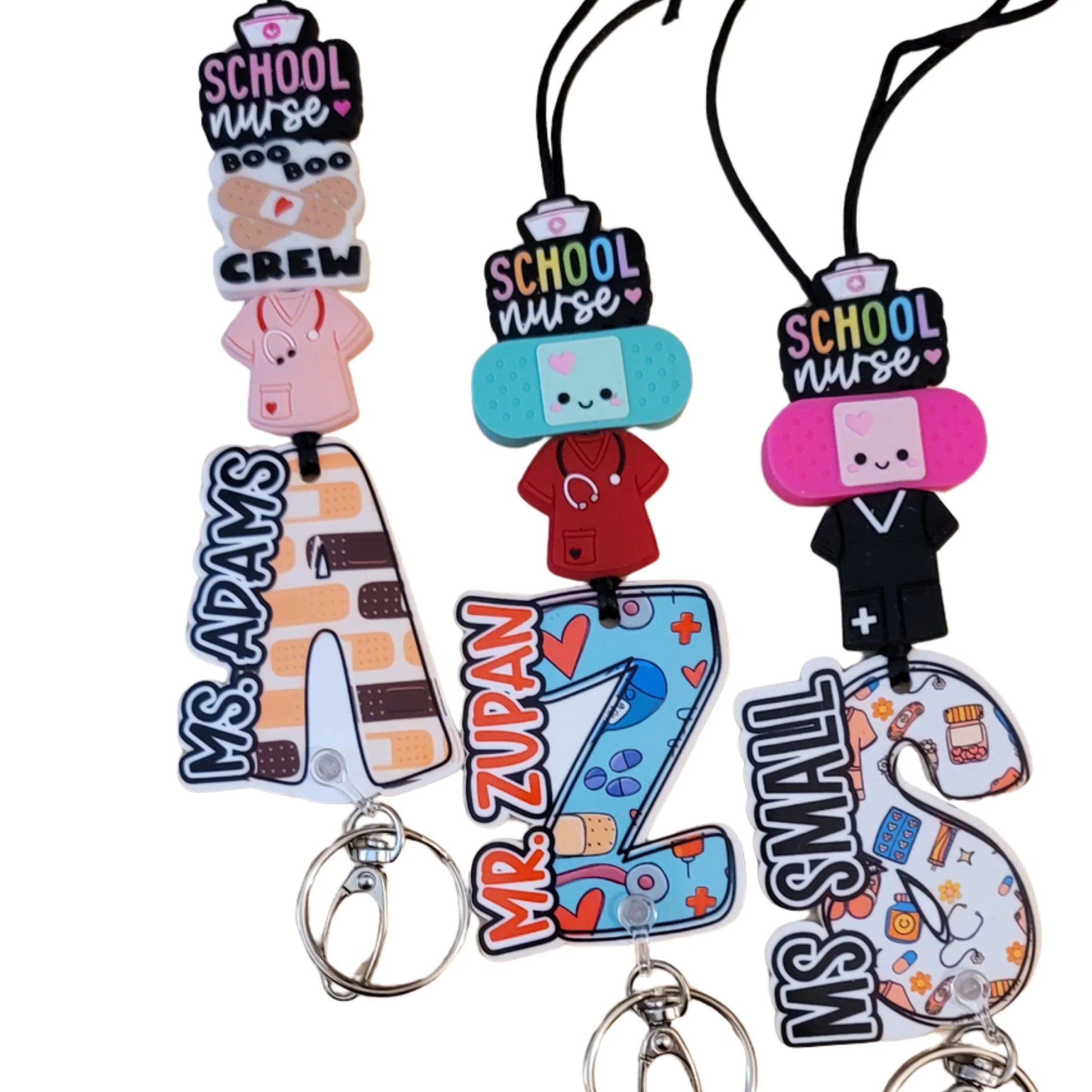 Colorful handmade school nurse badge reels with personalized names and medical charms, unique gift.