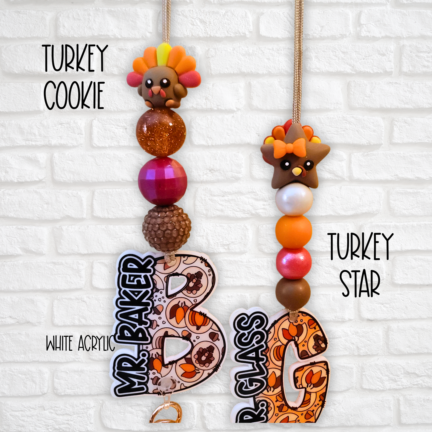 Thanksgiving-themed beaded keychains with turkey decorations and autumn pattern initials on white brick background