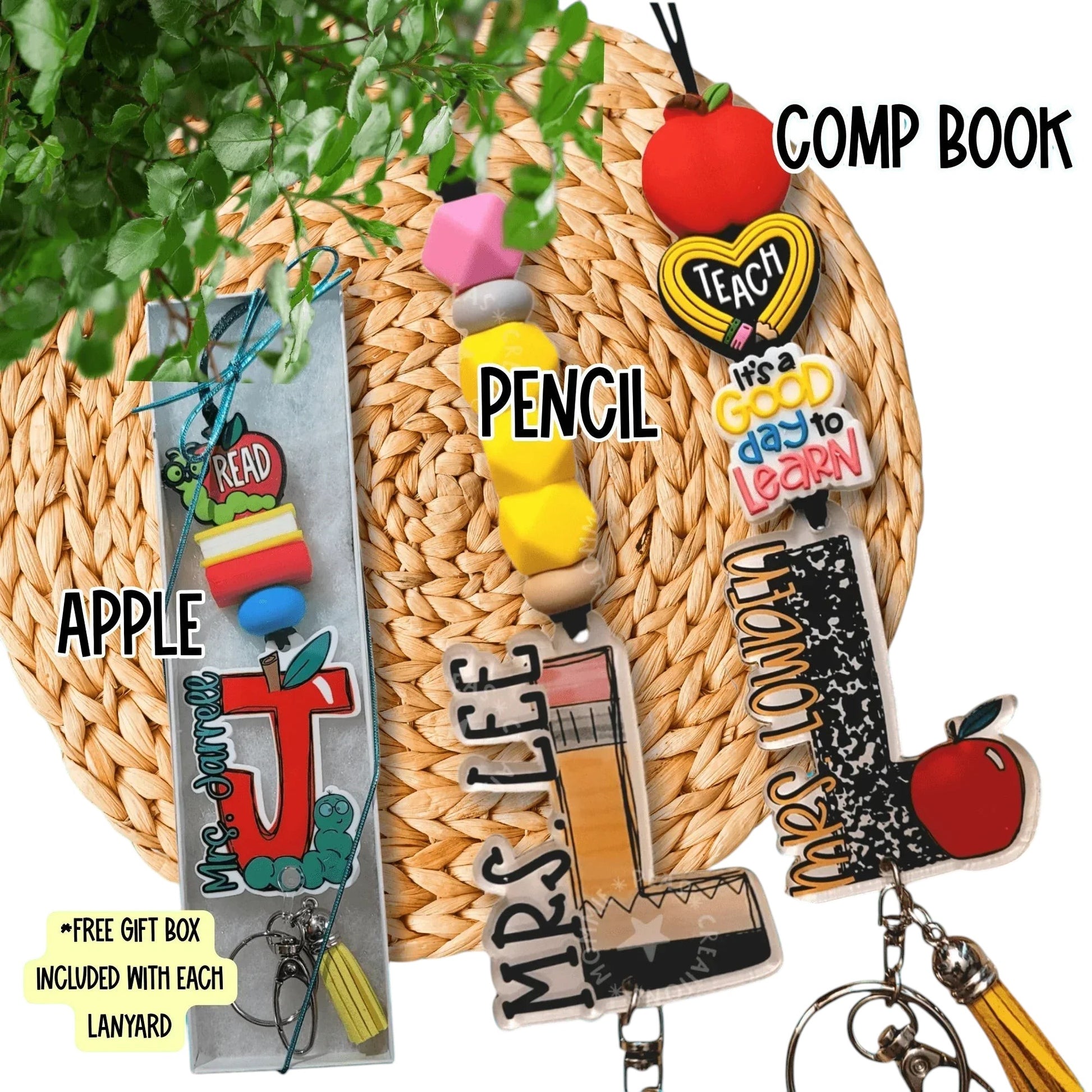 Colorful handmade teacher lanyards with apple, pencil, and composition book charms on woven mat