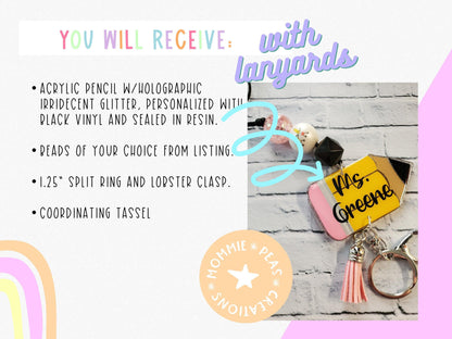 Personalized acrylic pencil keychain with beads, pink tassel, split ring, and lobster clasp on brick background