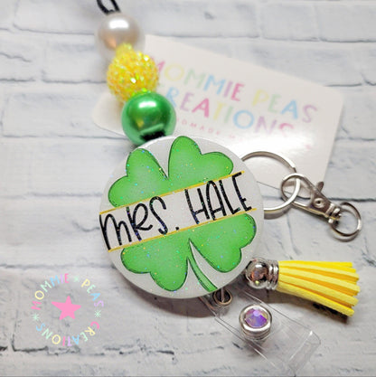 Personalized ID badge reel with green shamrock, yellow tassel, and beads for Mrs. Hale