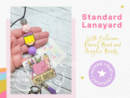 Hand holding custom lanyard with silicone pencil bead, acrylic beads, and personalized tag reading Mrs. Griffin