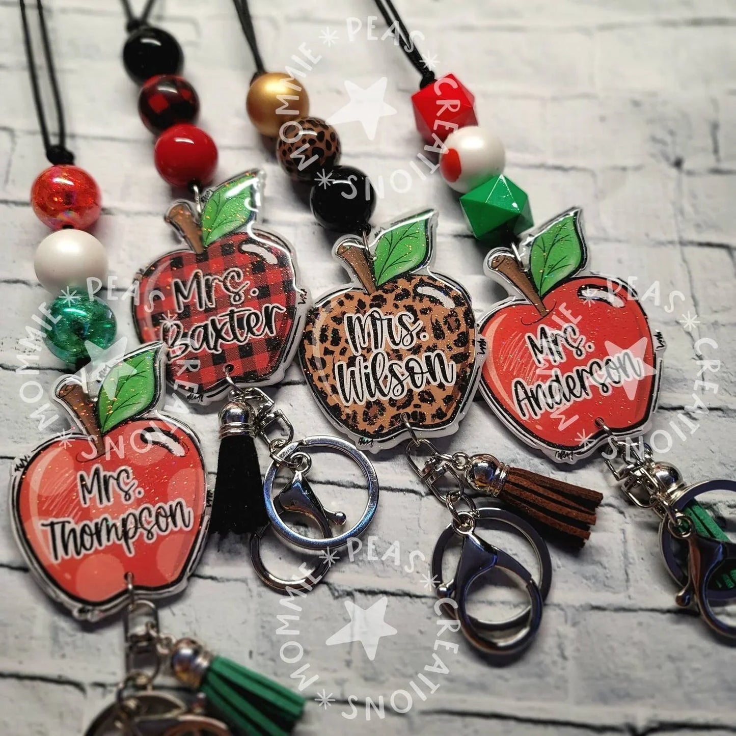Handmade apple-shaped lanyards with colorful beads and custom names, unique teacher gifts