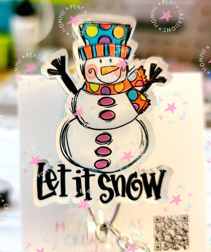 Colorful snowman sticker with polka dot hat and striped scarf, text saying 'Let it snow'