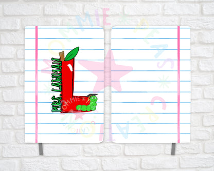 Notebook cover with red letter L apple and green worm wearing graduation cap labeled Mrs. Lawman