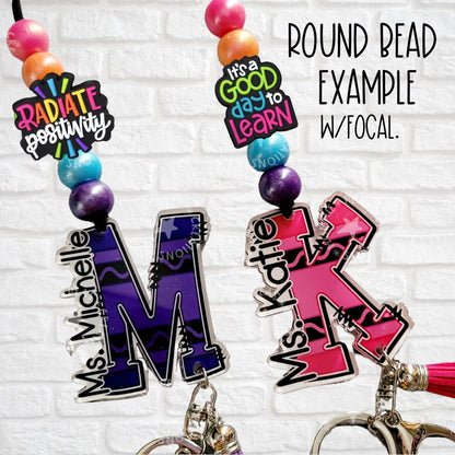 Colorful personalized teacher keychains with round beads featuring names Ms. Michelle and Ms. Katie