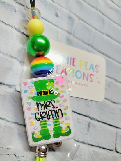 Personalized St. Patrick's Day badge reel with green leprechaun hat and boots, colorful beads