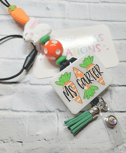 Personalized badge reel with Ms. Carter name, carrot and bunny charm, orange polka dot bead, and green tassel