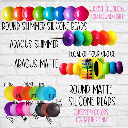 Colorful round shimmer and matte silicone beads with abacus shapes and various bright colors on white brick background