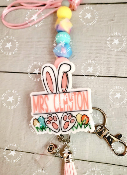 Personalized bunny bunny ears keychain with name Mrs. Clanton and colorful beads on pink string