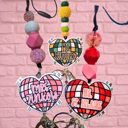 Colorful handmade heart-shaped custom badge reels with vibrant beaded lanyards, unique teacher gifts