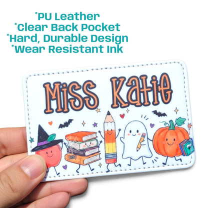 Mommie Peas Creations personalized Halloween teacher ID badge holder in white PU leather with ghost and pumpkin art.