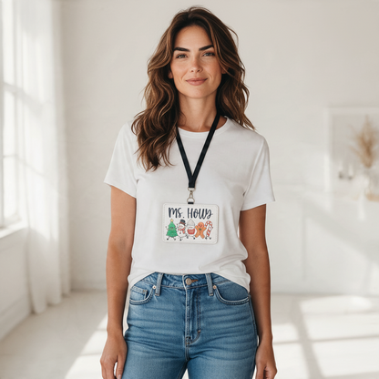 Mommie Peas Creations festive holiday character badge holder worn by a woman in a white t-shirt and blue jeans.