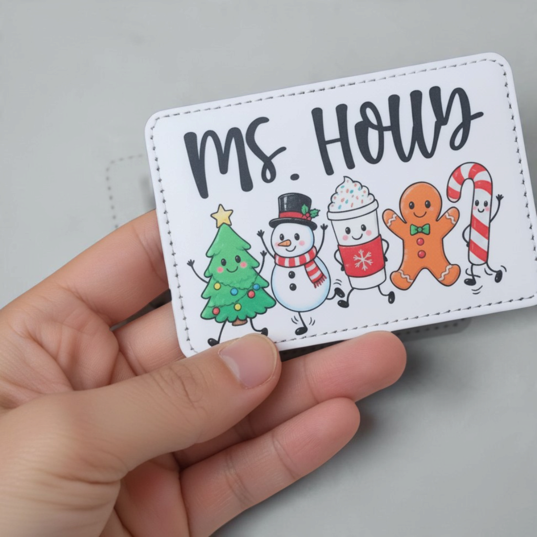 Mommie Peas Creations festive holiday badge holder with Ms. Holly text and cute Christmas character illustrations.