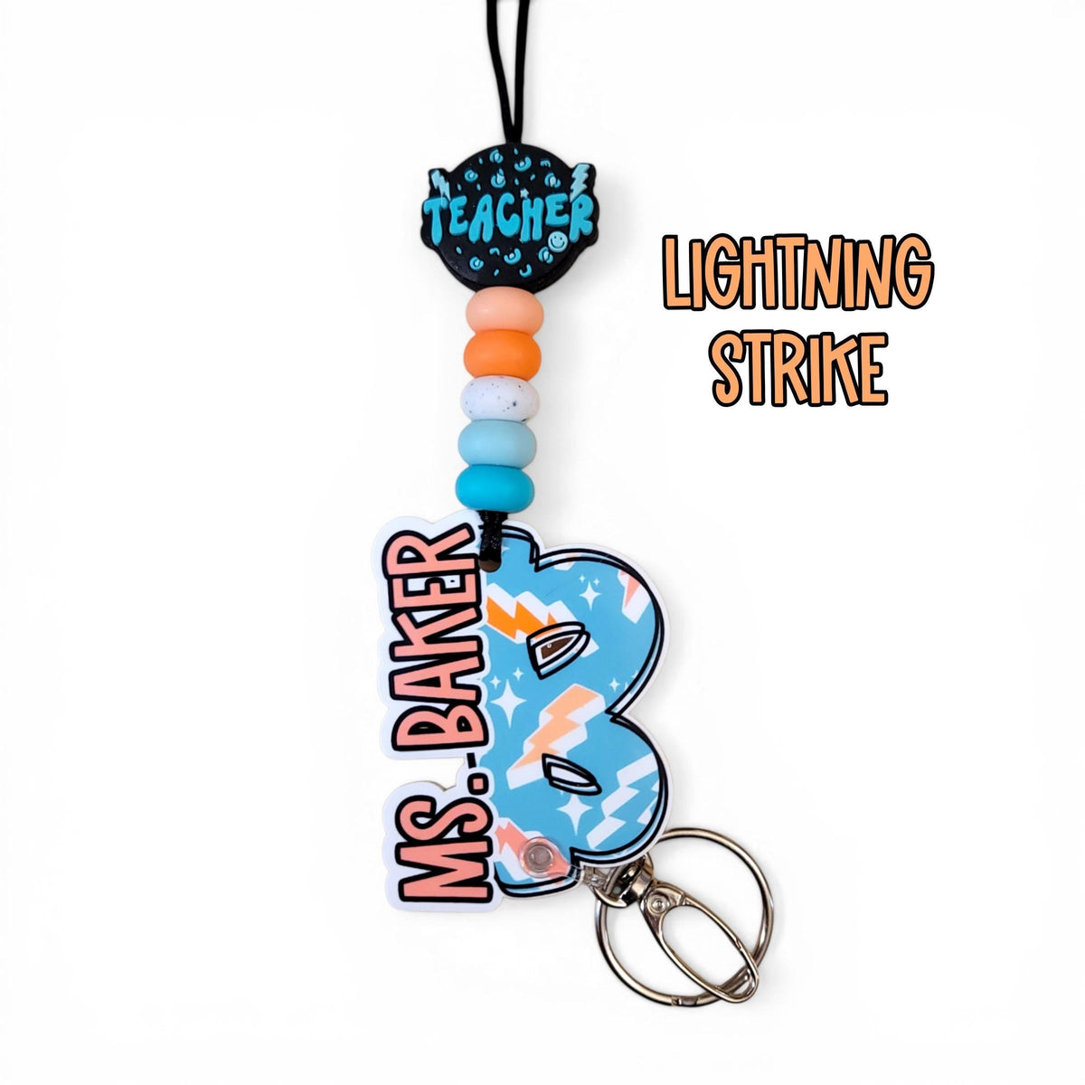 Mommie Peas Creations personalized teacher lanyard with Lightning Strike design, silicone beads, and name charm.