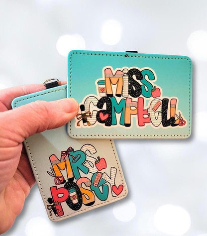 Mommie Peas Creations personalized faux leather ID badge holders with teacher-themed apple and pencil motifs