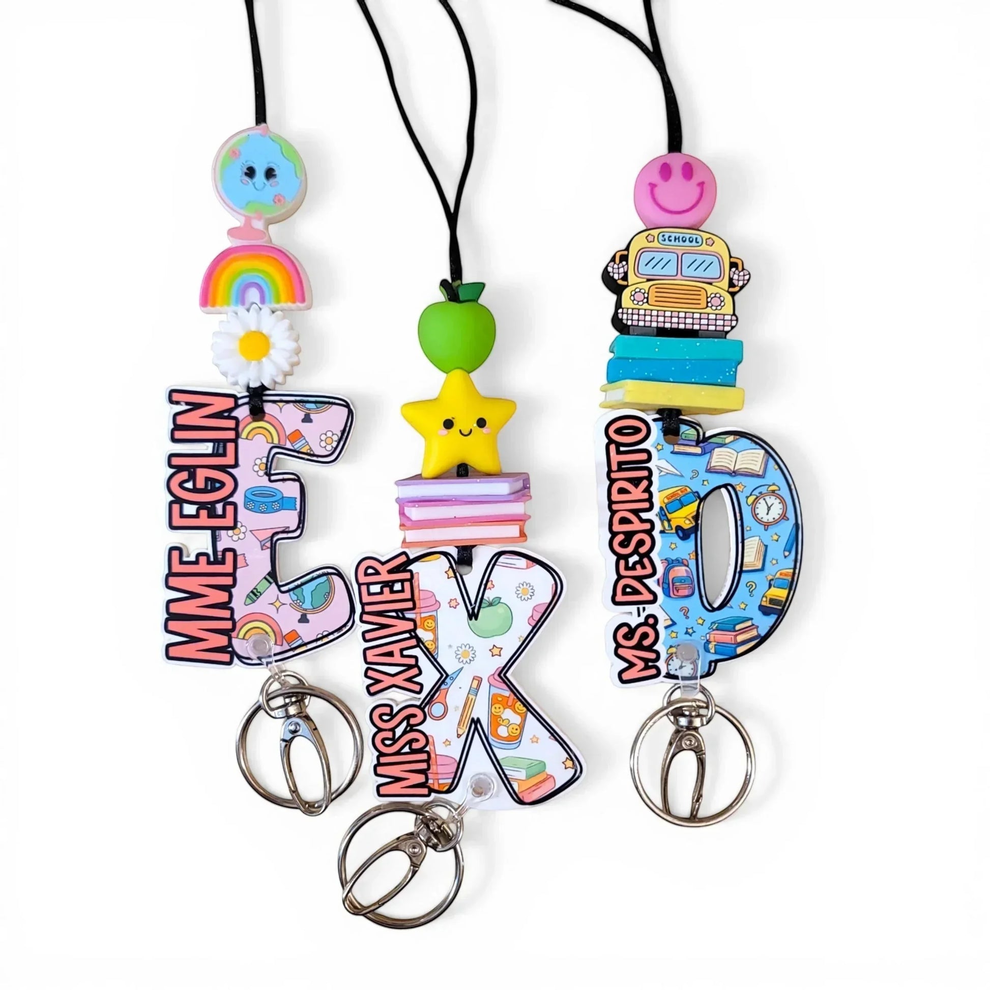 Colorful handmade teacher lanyards with personalized names and fun designs from Mommie Peas Creations