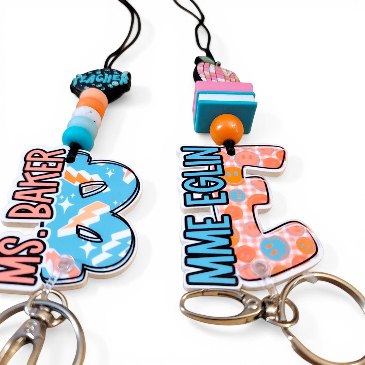 Mommie Peas Creations personalized teacher lanyards with colorful silicone beads, custom name charms, and metal clips.