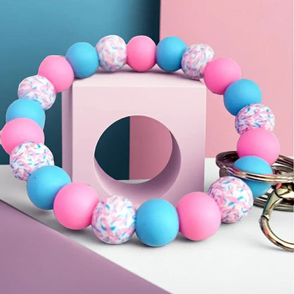 Mommie Peas Creations pink, blue, and patterned silicone beaded wristlet keychain for infant loss awareness.