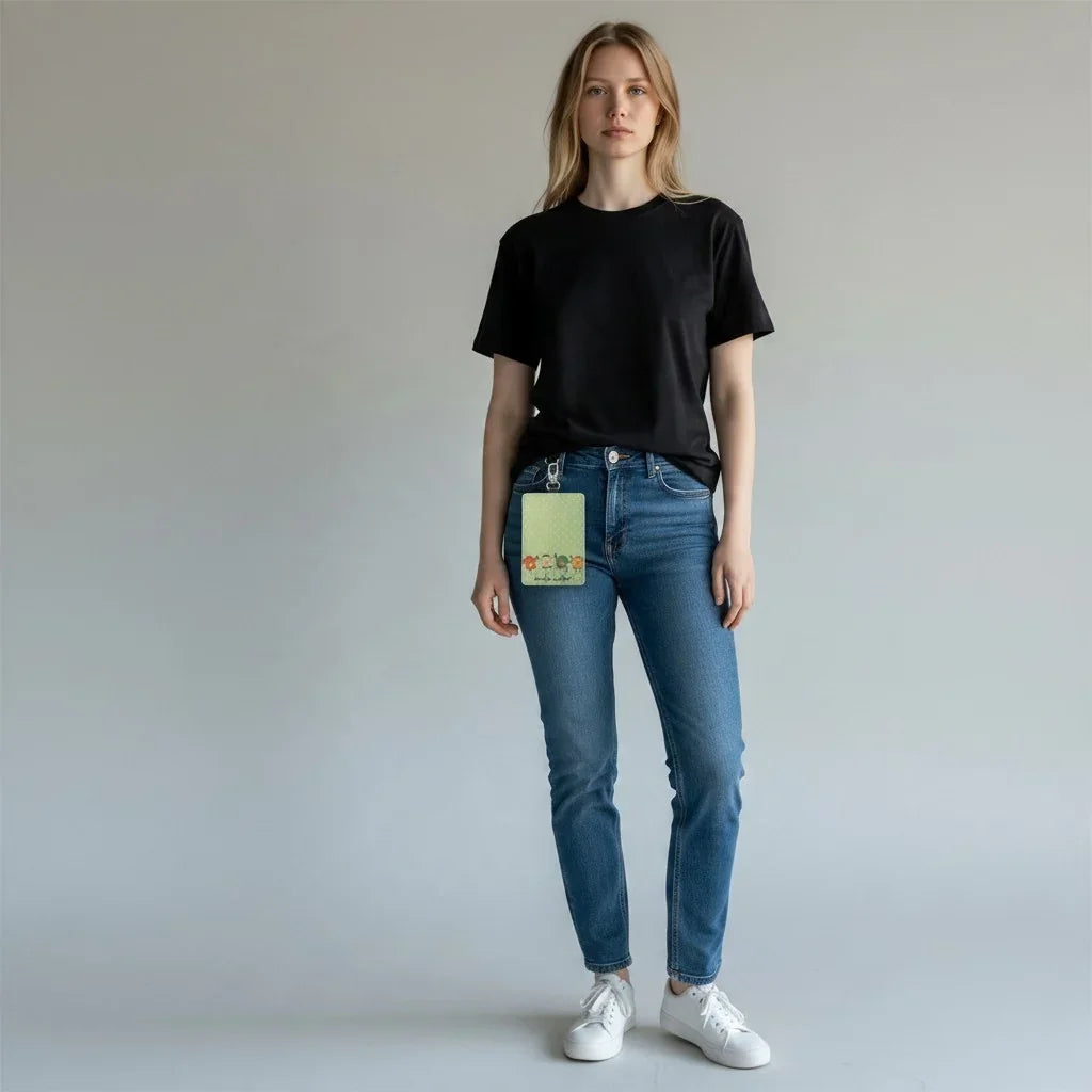 Woman wearing a green floral Mommie Peas Creations handmade badge holder on blue jeans.