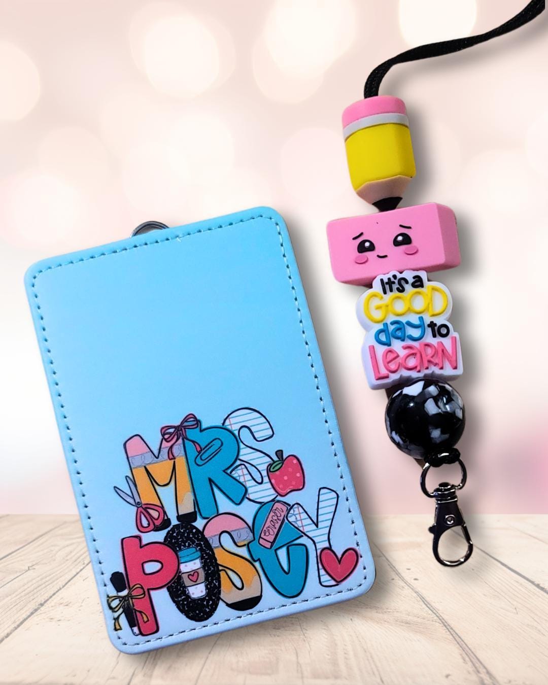 Mommie Peas Creations personalized light blue faux leather teacher ID badge holder with matching pencil bead lanyard