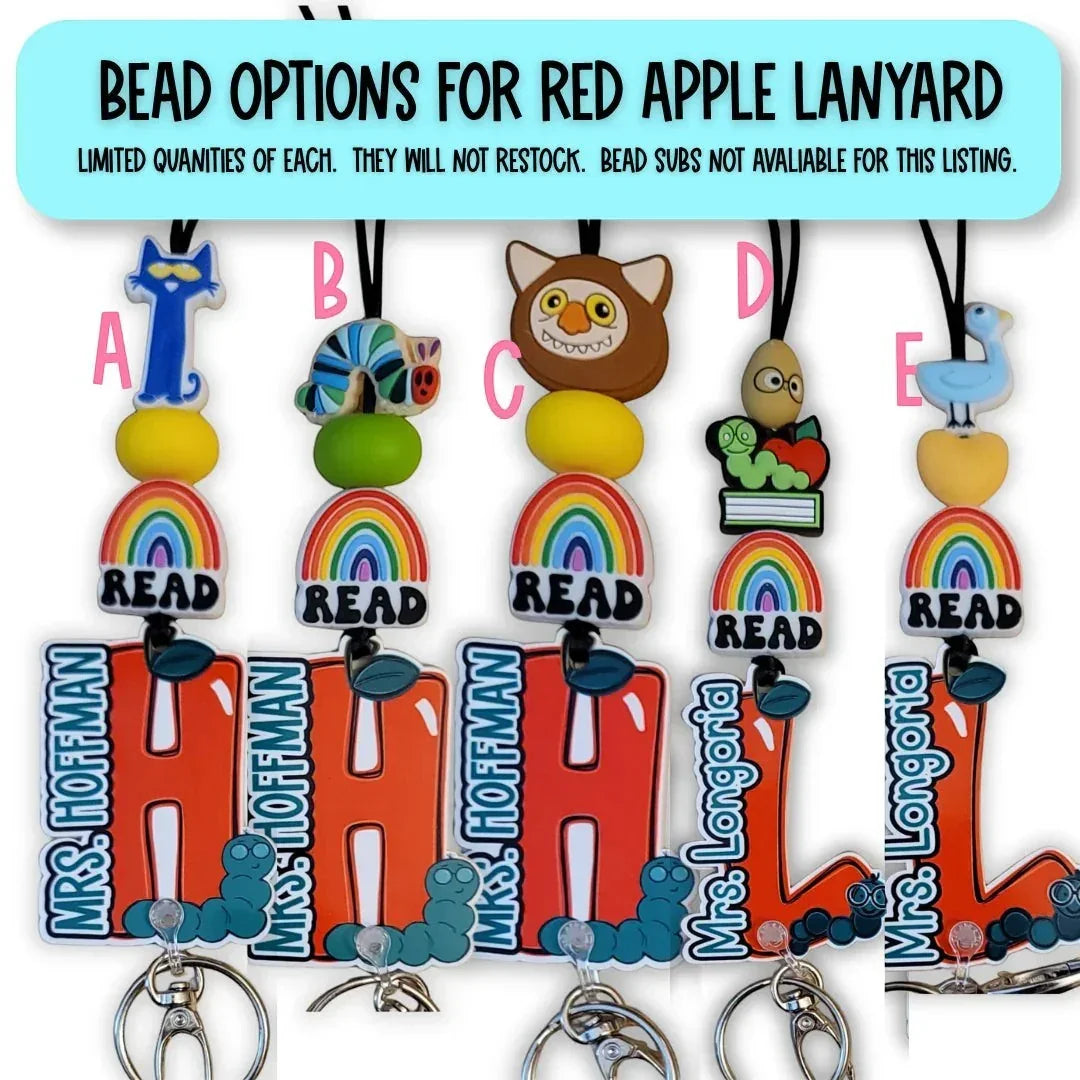 Mommie Peas Creations personalized teacher lanyard with rainbow, READ charm, and custom name. Options include The Cat in the Hat, The Very Hungry Caterpillar, Owl, and The Very Busy Spider.