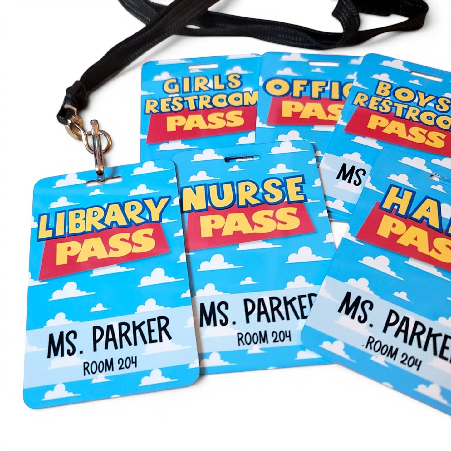 Mommie Peas Creations personalized metal classroom hall passes with a blue sky and white cloud Toy Story design.