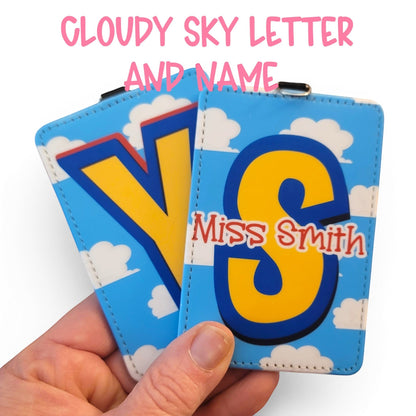 Mommie Peas Creations personalized Toy Story inspired ID badge holders with blue sky and white cloud design.