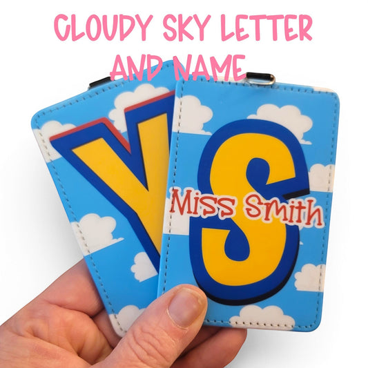 Mommie Peas Creations personalized Toy Story inspired ID badge holders with blue sky and white cloud design.