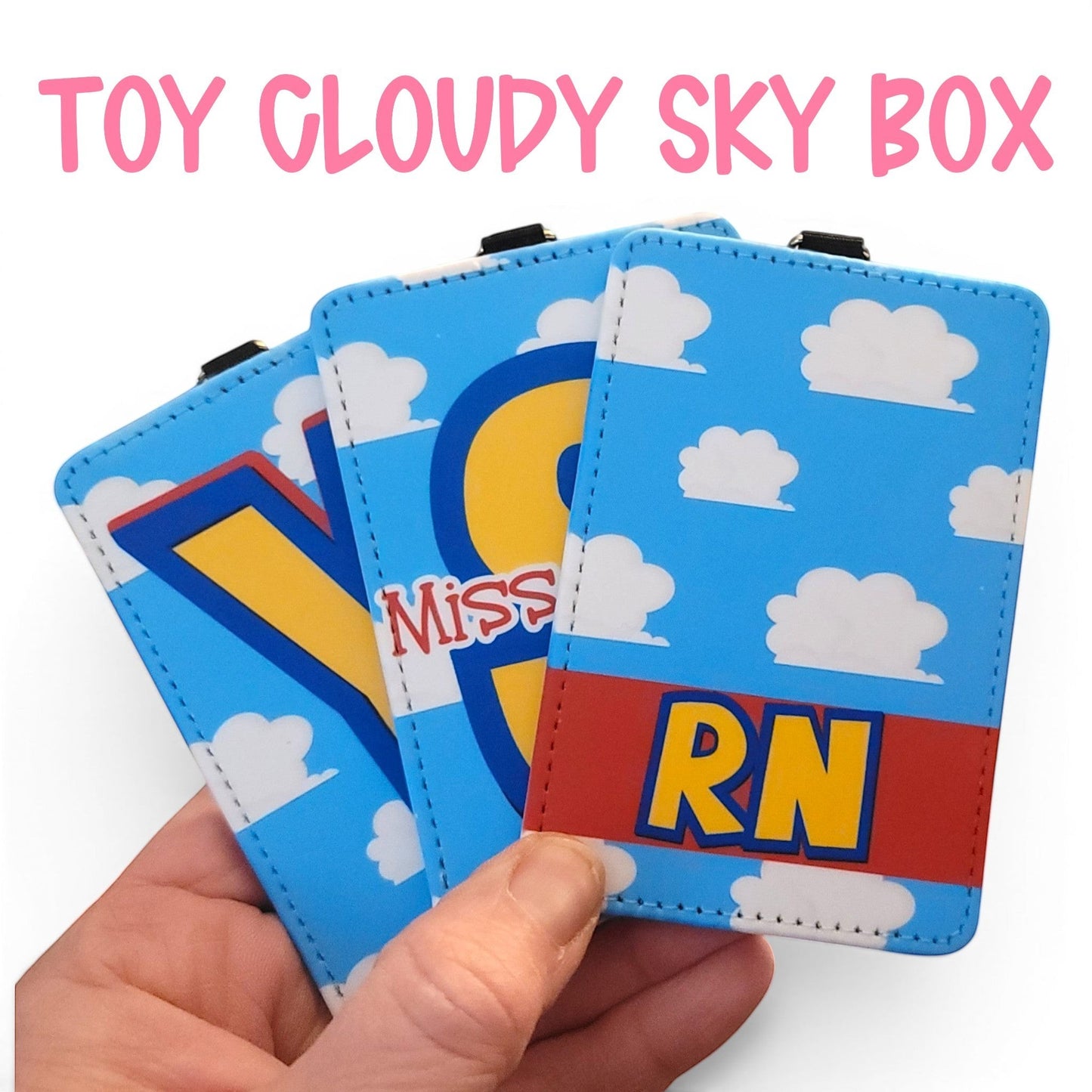 Mommie Peas Creations personalized Toy Story inspired ID badge holders with blue sky and white cloud pattern.