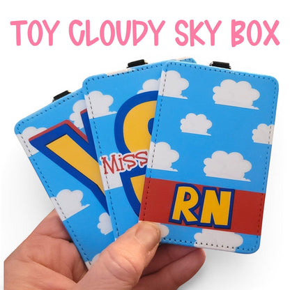 Mommie Peas Creations personalized Toy Story inspired ID badge holders with blue sky and white cloud pattern.