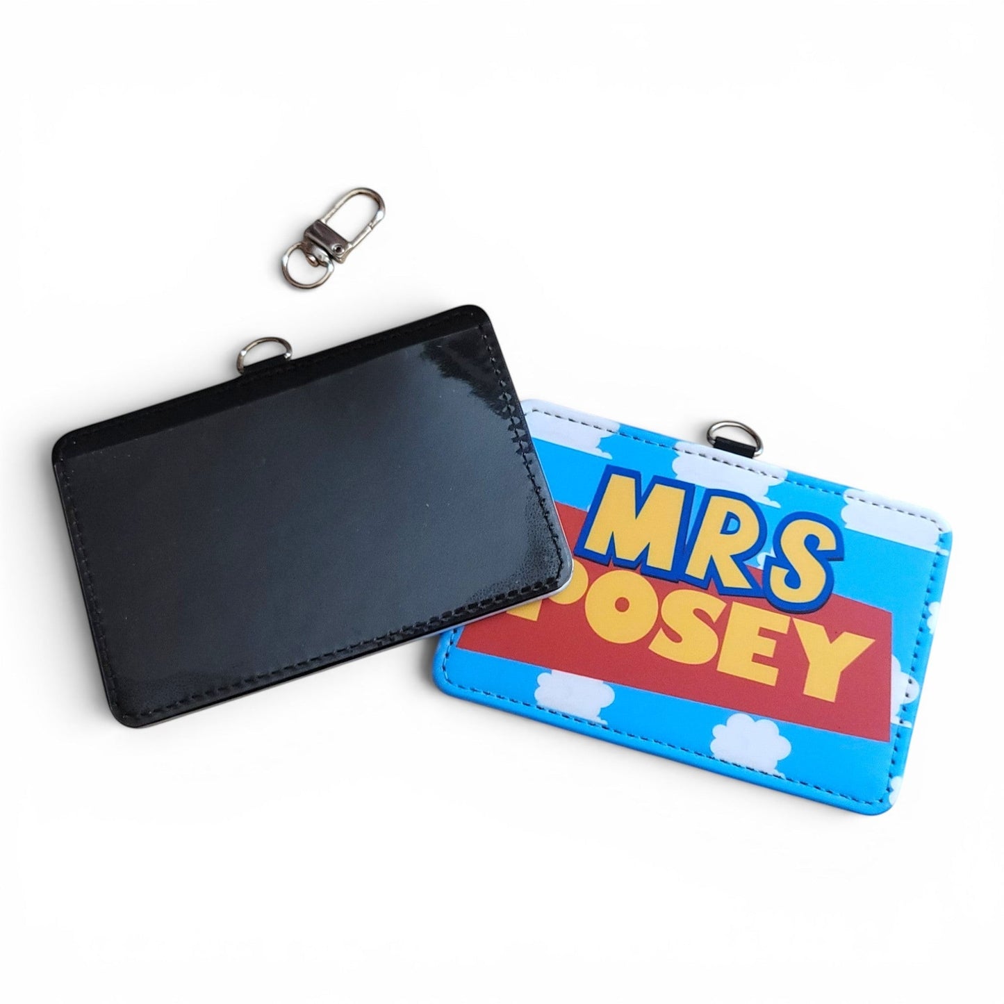 Mommie Peas Creations personalized Toy Story inspired ID holder with cloudy sky print and swivel clasp.