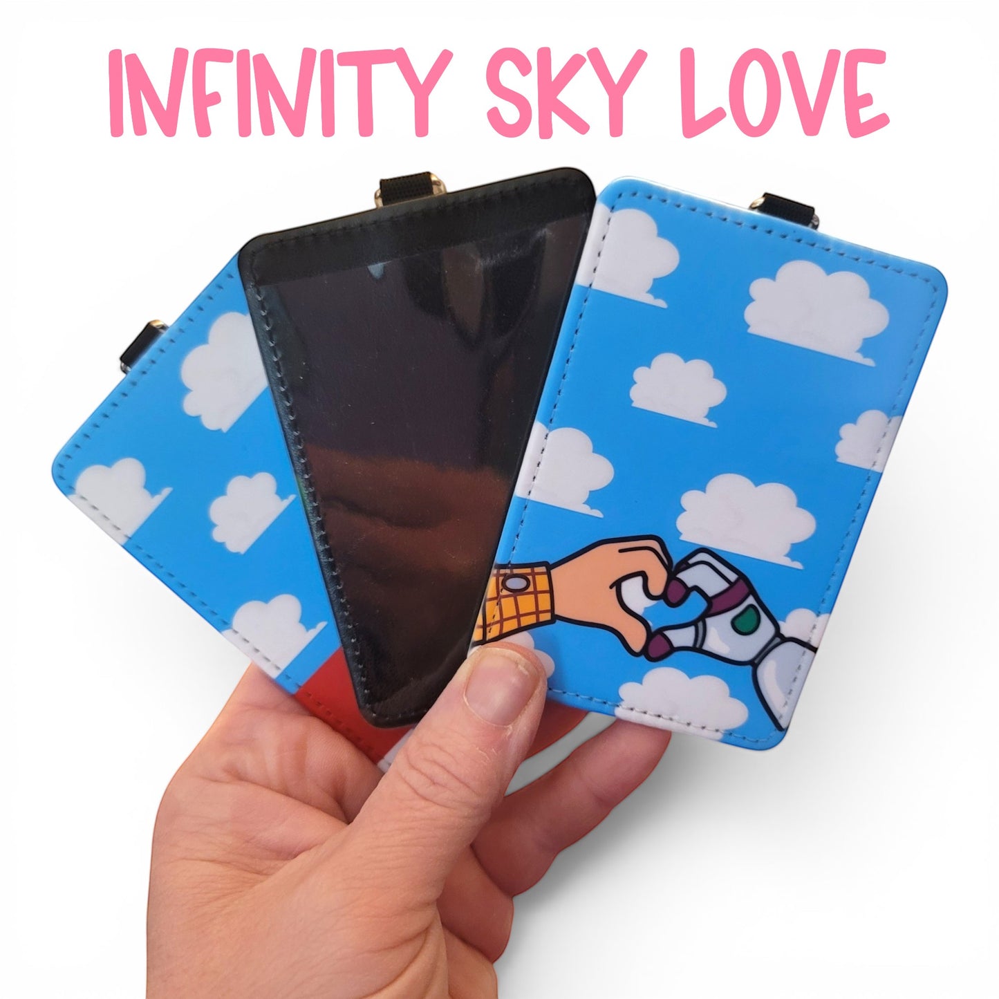 Mommie Peas Creations Toy Story inspired ID holder with blue cloudy sky print and Woody and Buzz heart hand design.