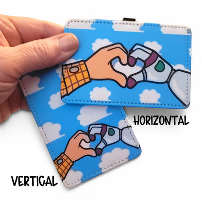 Mommie Peas Creations Toy Story inspired PU leather ID holder with Woody and Buzz heart design on cloudy sky background