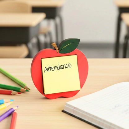 Mommie Peas Creations red apple sticky note holder made of laser cut wood, with a yellow sticky note that says "Attendance".