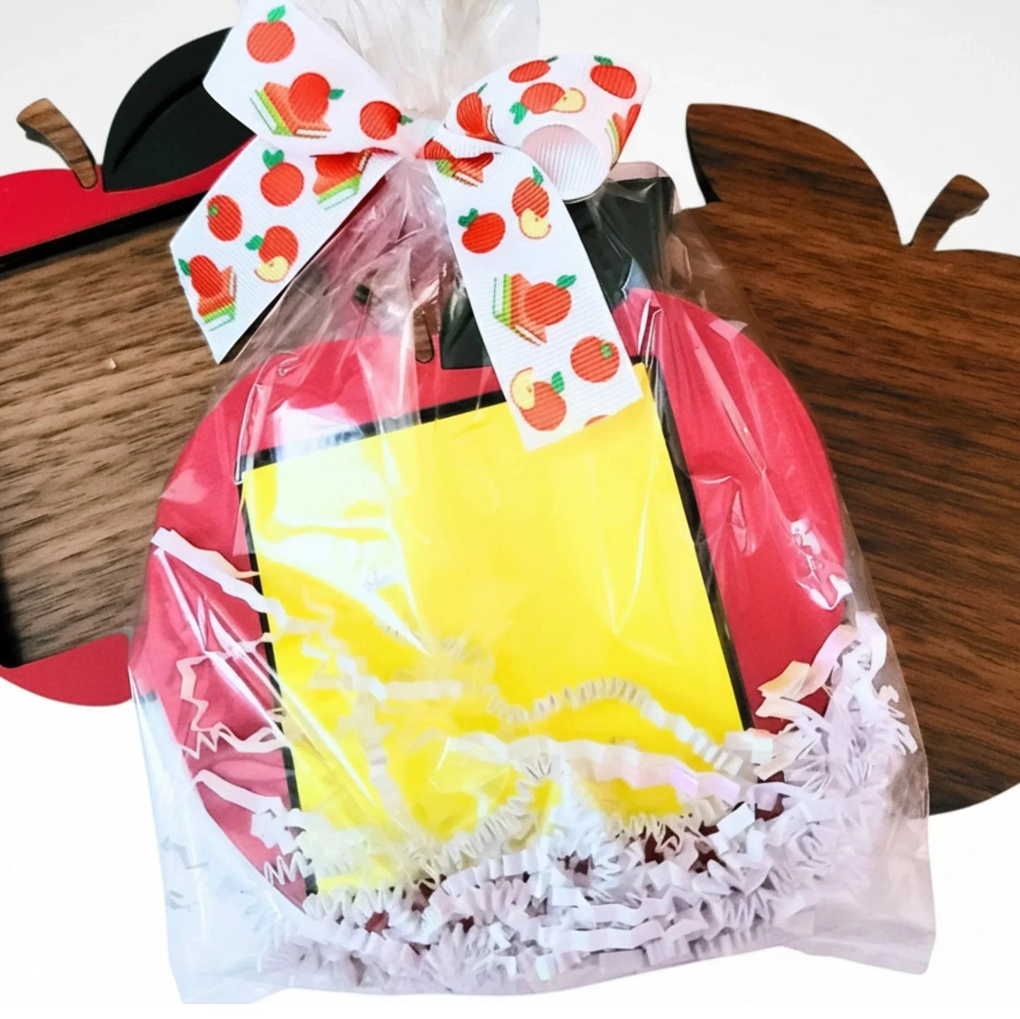 Mommie Peas Creations red apple sticky note holder made from laser cut wood, tied with apple-themed ribbon.