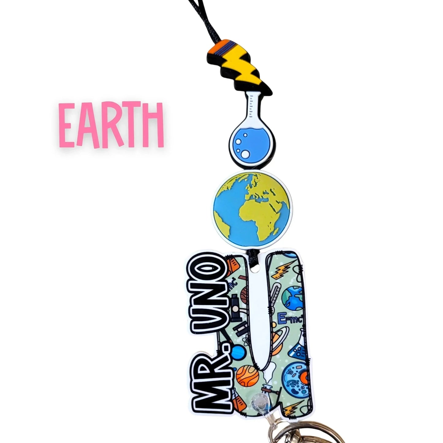 Mommie Peas Creations Earth science lanyard with planet Earth, beaker, and lightning bolt charms. Features custom name plate.