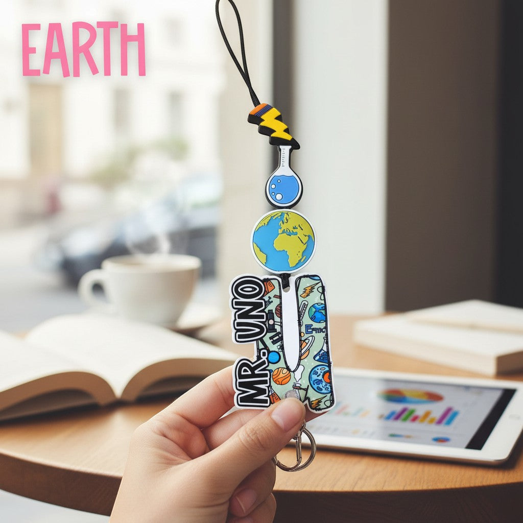 Mommie Peas Creations Earth science lanyard with planet Earth, flask, and lightning bolt charms. Features "MR. UNO" personalization.