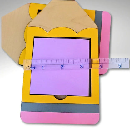 Mommie Peas Creations yellow, pink, and grey wooden pencil Post-It note holder. Holds 3x3 inch notes.