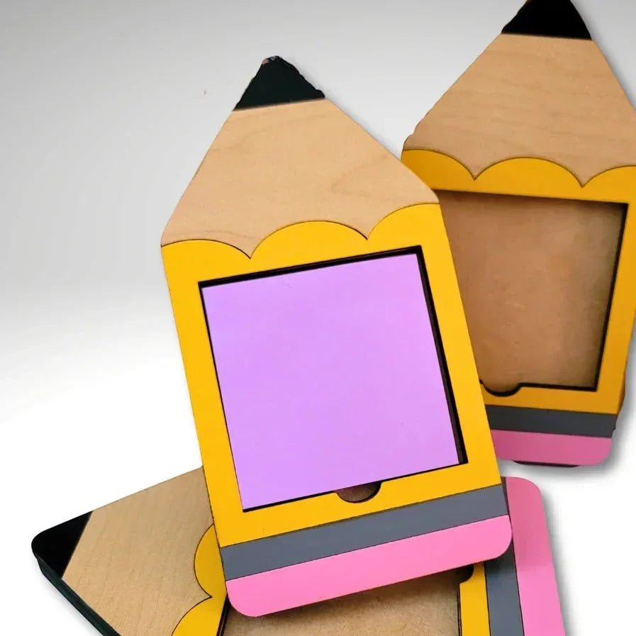 Mommie Peas Creations laser cut wooden pencil Post-it note holder, yellow with pink eraser and grey band, holds 3x3 notes.